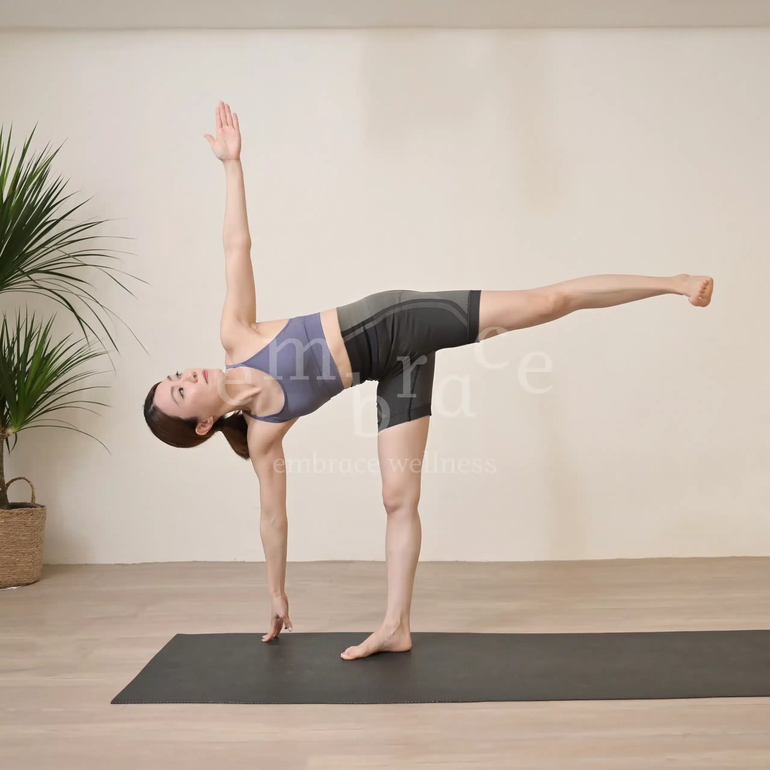 Manlee W, yoga teacher from Newbury Berkshire, in Half Moon Pose, demonstrating breath‑led movement, balance, and mindful strength.