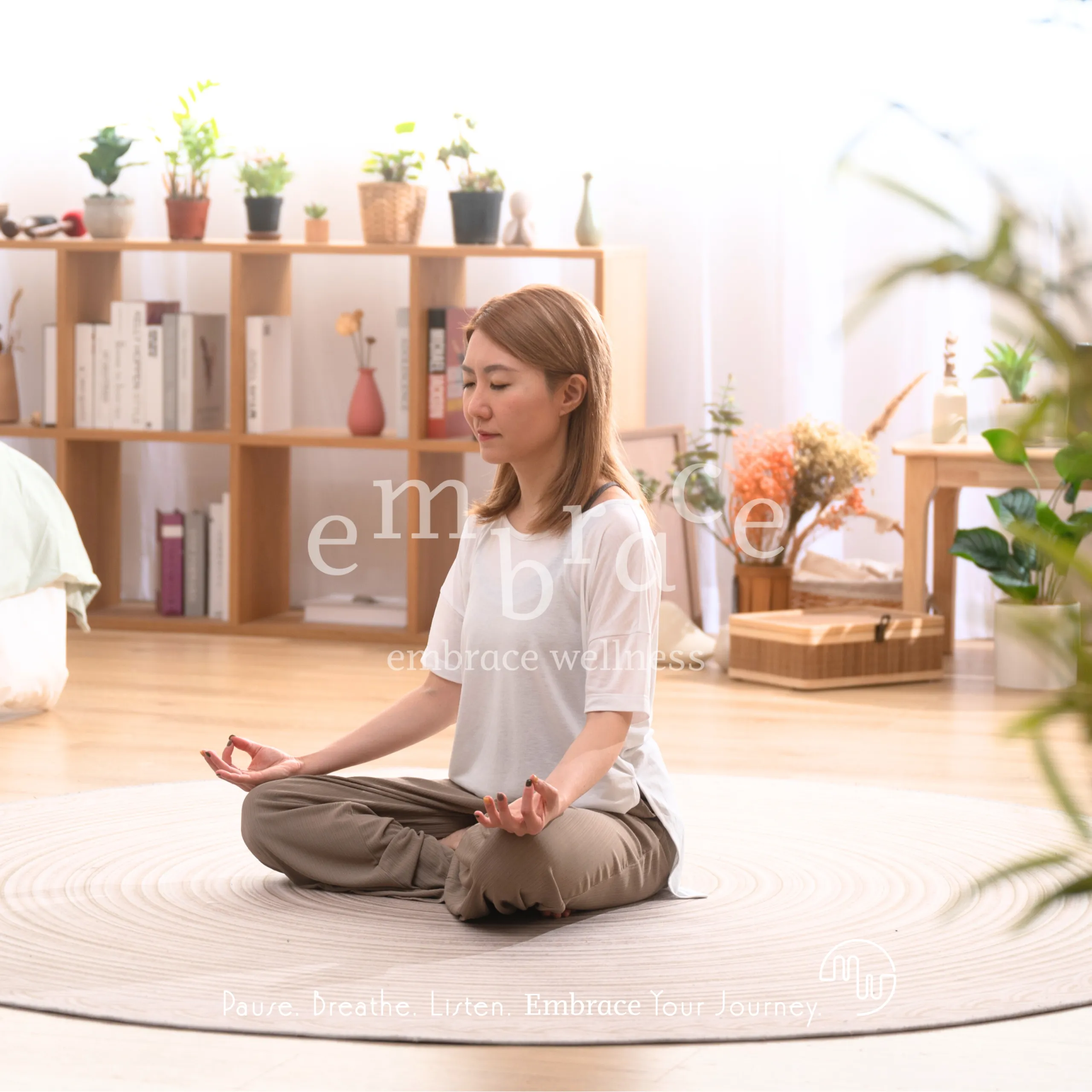Manlee W meditating in lotus pose in a peaceful wellness space – mindful yoga and holistic wellness Newbury