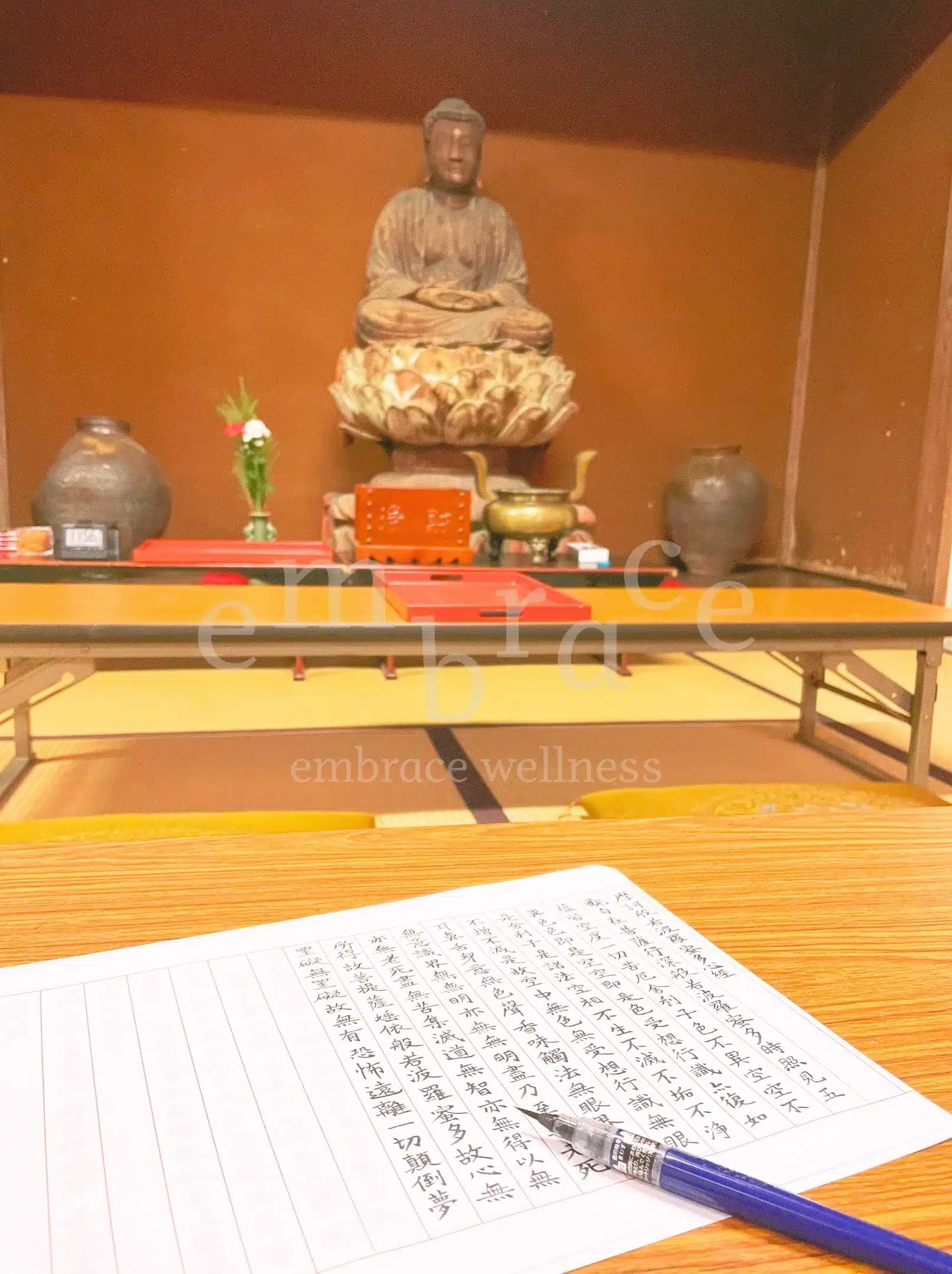 Shakyō (sutra copying) practice at HouKouji Temple in Japan, with handwritten Buddhist text, a pen, and altar during a ZEN temple stay