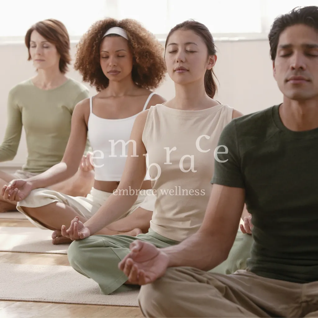 Small group yoga class seated in lotus meditation pose — lunchtime yoga class Gentle Vinyasa Flow Yoga in Newbury, Berkshire with Embrace Wellness