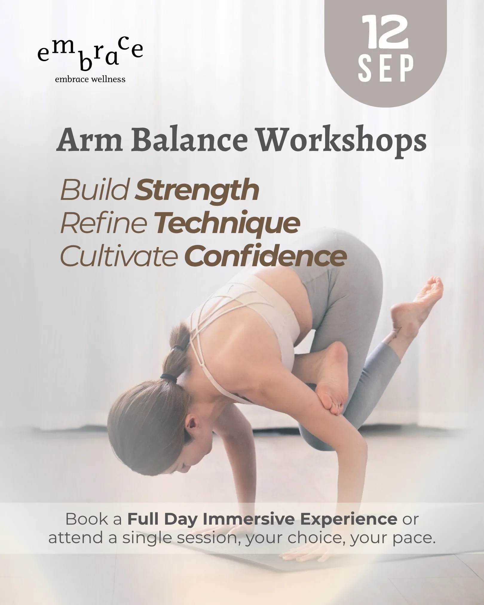 Arm balance workshop in Newbury featuring yoga teacher Manlee W demonstrating baby flying pigeon pose variation to build strength and confidence in Berkshire.